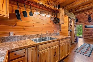 Experience true Northwoods living in this beautiful full log - photo 19