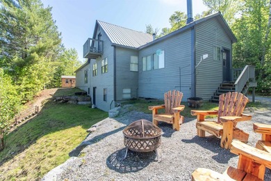 Discover year-round lakeside living with this inviting 3-bedroom - photo 1