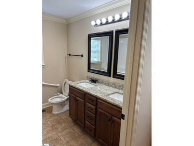 HANDICAP ACCESSIBLE! Welcome home to this beautifully maintained - photo 9