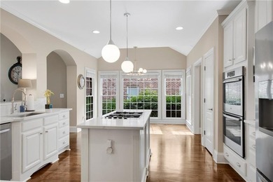 Elegant four-sided brick home with a luxurious primary suite on - photo 11