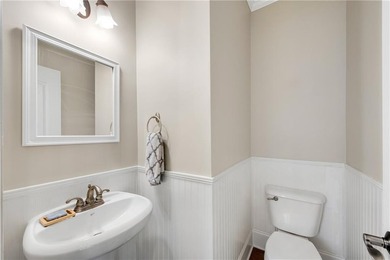 Elegant four-sided brick home with a luxurious primary suite on - photo 15