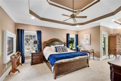 Elegant four-sided brick home with a luxurious primary suite on - photo 19