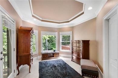 Elegant four-sided brick home with a luxurious primary suite on - photo 21