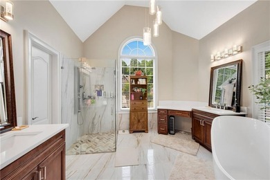 Elegant four-sided brick home with a luxurious primary suite on - photo 24