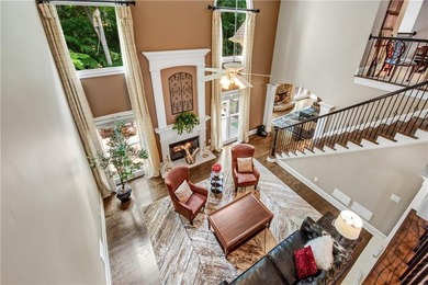 Elegant four-sided brick home with a luxurious primary suite on - photo 28