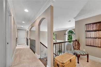 Elegant four-sided brick home with a luxurious primary suite on - photo 29