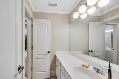 Elegant four-sided brick home with a luxurious primary suite on - photo 34