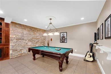 Elegant four-sided brick home with a luxurious primary suite on - photo 36