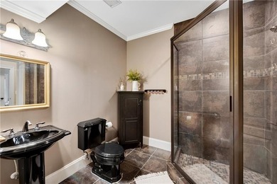 Elegant four-sided brick home with a luxurious primary suite on - photo 42
