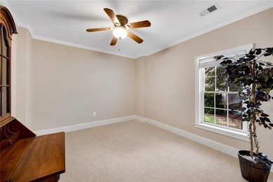 Elegant four-sided brick home with a luxurious primary suite on - photo 43