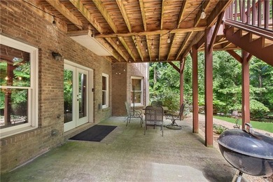 Elegant four-sided brick home with a luxurious primary suite on - photo 45