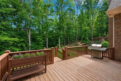 Elegant four-sided brick home with a luxurious primary suite on - photo 46