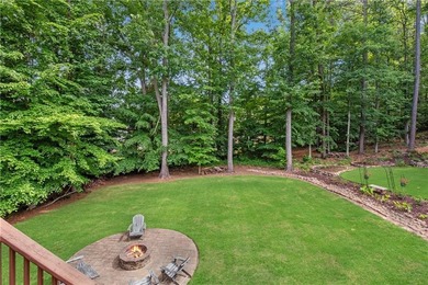 Elegant four-sided brick home with a luxurious primary suite on - photo 47
