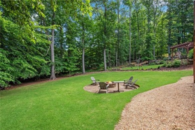 Elegant four-sided brick home with a luxurious primary suite on - photo 48