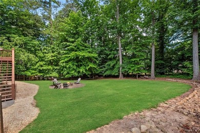 Elegant four-sided brick home with a luxurious primary suite on - photo 49
