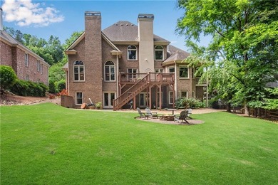 Elegant four-sided brick home with a luxurious primary suite on - photo 50