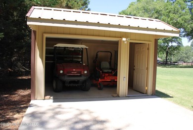 Lovely one-level home situated on a gated 4.8-acre lot in the - photo 38