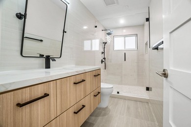 Presenting a COMPLETELY REMODELED 4-bedroom, 4-bath family home - photo 25