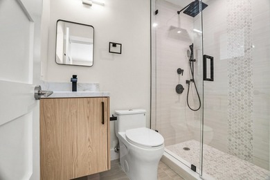 Presenting a COMPLETELY REMODELED 4-bedroom, 4-bath family home - photo 28