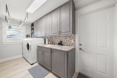 Experience elevated waterfront living in this totally remodeled - photo 23