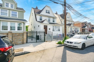 Beautifully renovated legal two-family home offering updates - photo 1