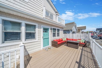 Just over one block from the beach, this fully renovated home - photo 3