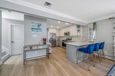 Just over one block from the beach, this fully renovated home - photo 8
