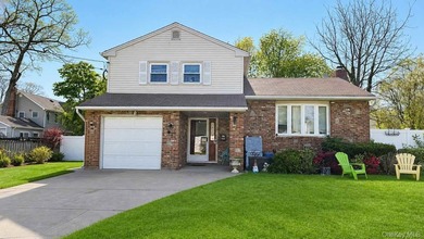 Welcome to this charming Massapequa home offering comfort - photo 1