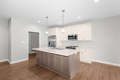 Welcome to Woodland Ridge! Built in 2022, this thoughtfully - photo 9
