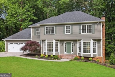 Nestled on nearly half an acre in a quiet cul-de-sac, this - photo 1