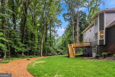 Nestled on nearly half an acre in a quiet cul-de-sac, this - photo 2