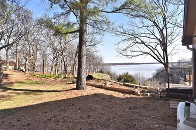A stunning lake view welcome's you the moment you step inside - photo 26