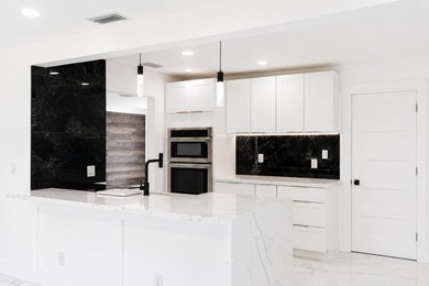 WELCOME TO YOUR FULLY REMODELED SOUTH FLORIDA RETREAT IN THE - photo 15