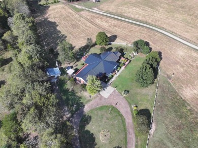 Looking for a relaxing homestead? This well-built brick home