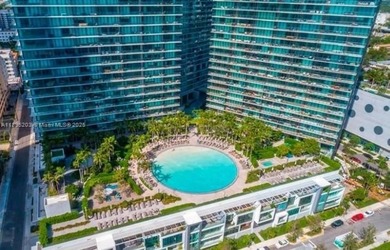 Step into refined luxury with this exquisite 2-bedroom + Den