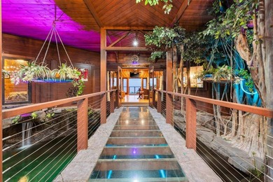 Set on 9.63 acres outside Hilo, this furnished 8-bedroom, 8-bath - photo 7