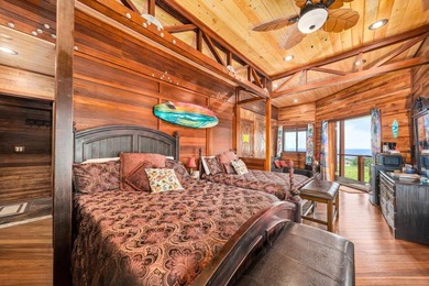 Set on 9.63 acres outside Hilo, this furnished 8-bedroom, 8-bath - photo 10