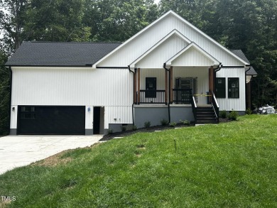 Welcome to 101 Cochise Cove, a 3-bedroom, 3.5-bath home with 3 - Lake Home For Sale in Louisburg, North Carolina
