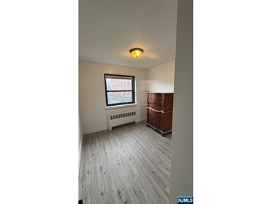 Welcome to Unit A7 at 2335 Hudson Terrace, a renovated 2-bedroom