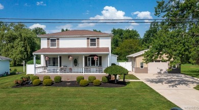 Welcome home to 212 East Ave! This inviting two-story home sits - photo 1