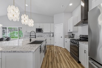 This contemporary home is on a half acre lot surrounded by - photo 12