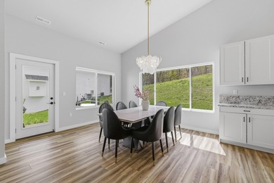 This contemporary home is on a half acre lot surrounded by - photo 13