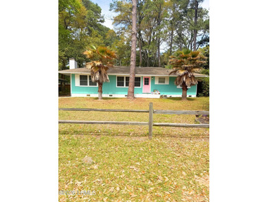 Discover the potential of 2403 Pine Court S, a 4-bedroom - photo 1