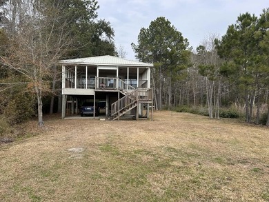 Tucked away on Choctawhatchee Bay, this charming Florida cottage - photo 4