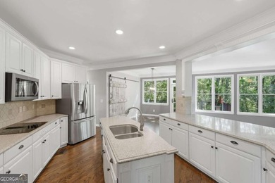 This stunning 6-bedroom, 5-bathroom riverfront home offers the - photo 12