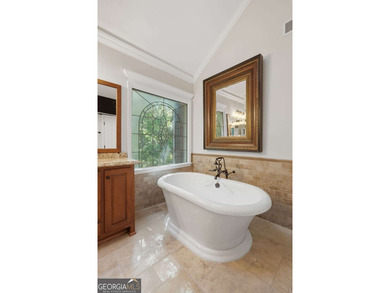This stunning 6-bedroom, 5-bathroom riverfront home offers the - photo 28