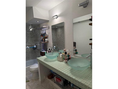 Wake up to breathtaking, unobstructed Intracoastal and Miami