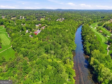 This stunning 6-bedroom, 5-bathroom riverfront home offers the - photo 57