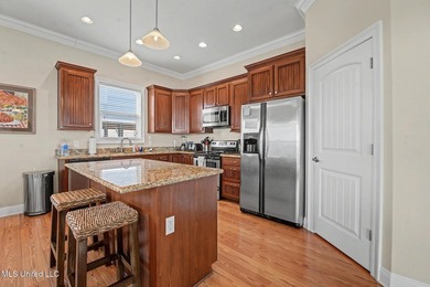 Welcome to refined coastal living in this custom-built - photo 12