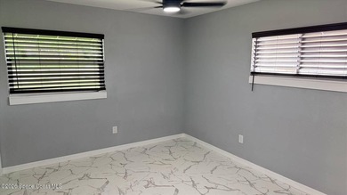 Beautifully remodeled concrete block 4/2 home with a new metal - photo 12